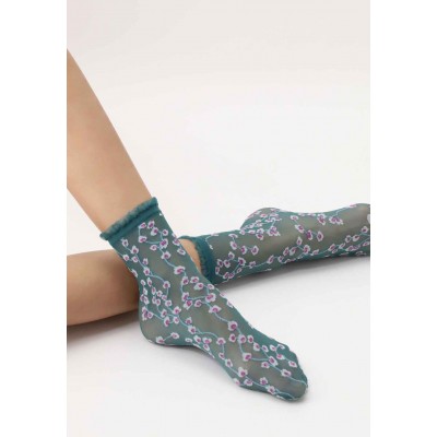 Chaussette verte petite fleurs marque Oroblu