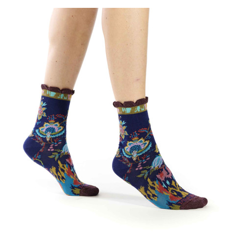Chaussettes Dub & Drino bleu marine avec des motifs de plantes et de formes géométriques.
